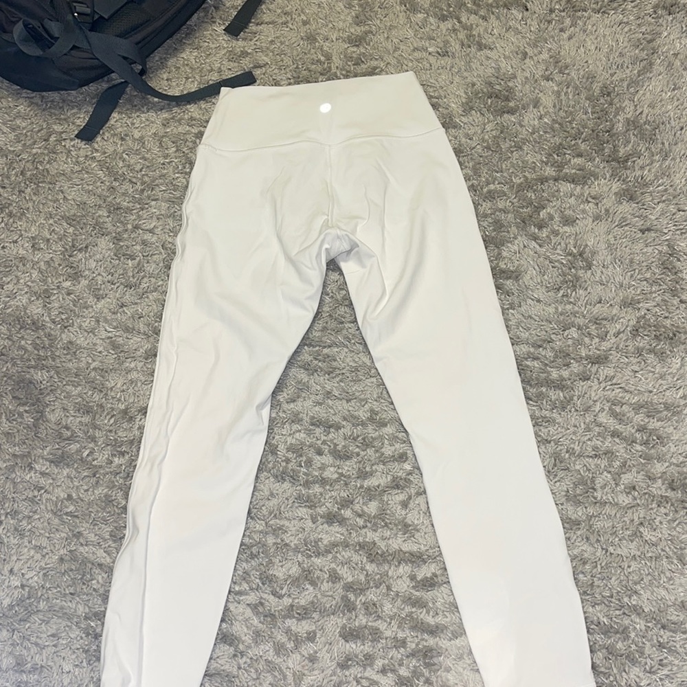 White size 6 lululemon leggings in almost perfect condition only worn few times